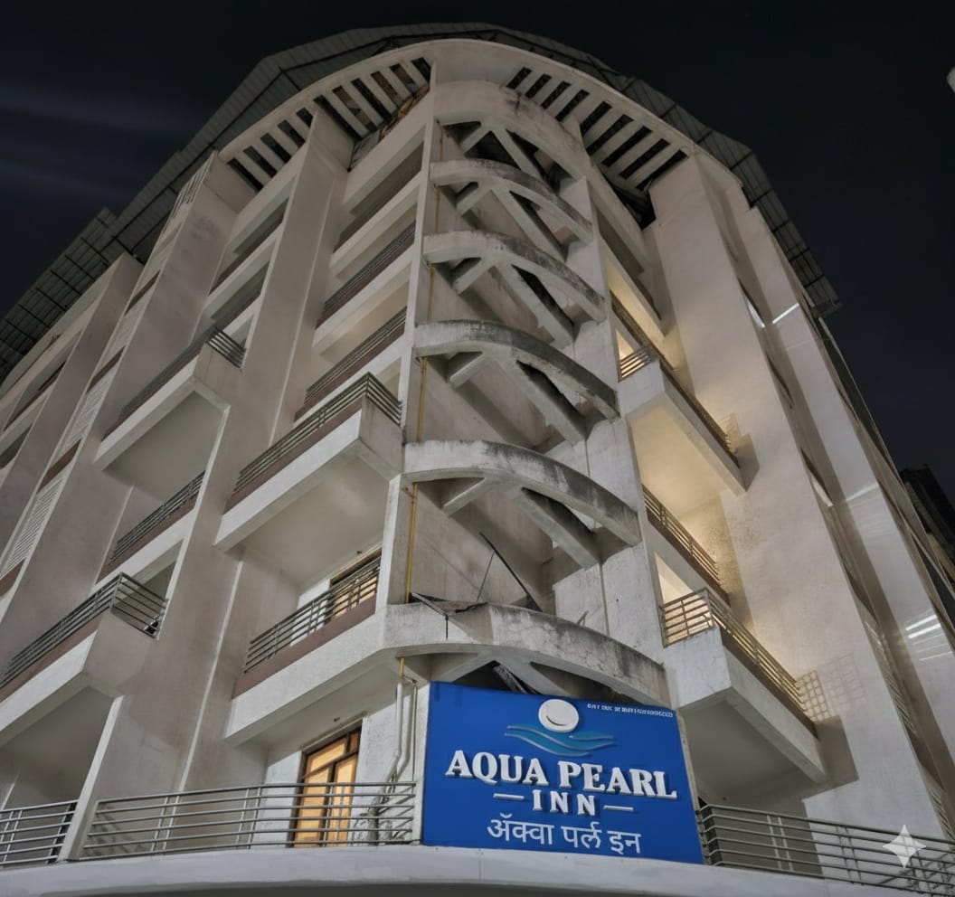 Aqua Pearl Inn building at night